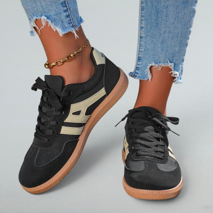 ZOFIA ATELIER black synthetic leather lace-up sneakers with beige side stripe and gum sole.