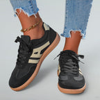 ZOFIA ATELIER black synthetic leather lace-up sneakers with beige side stripe and gum sole.