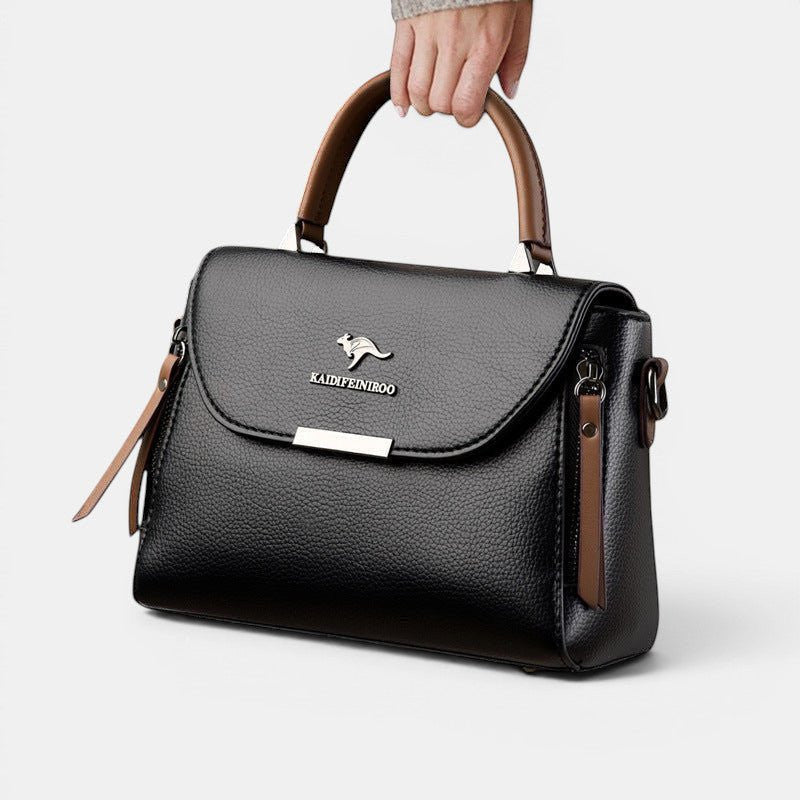 ZOFIA ATELIER black genuine leather crossbody shoulder bag with brown accents and silver kangaroo logo.