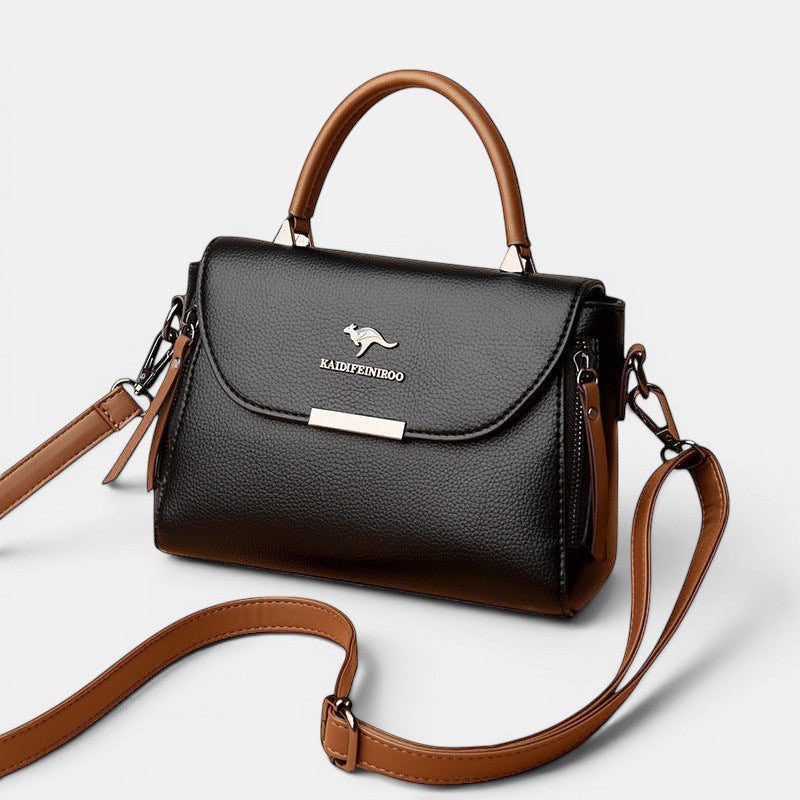 ZOFIA ATELIER black genuine leather crossbody shoulder bag with brown accents and silver hardware.