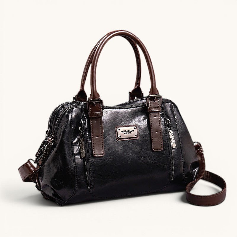 ZOFIA ATELIER black soft leather messenger bag with brown strap and handles, medium size with zipper closure.