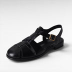 ZOFIA ATELIER black leather retro Roman sandals with hollowed design and gold buckle.