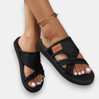 ZOFIA ATELIER MAJA black mesh cross-strap slide sandals with open toe and faux leather detail.