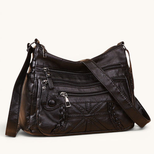 ZOFIA ATELIER black PU leather messenger bag with multiple zippered pockets and braided detail. Versatile for daily use.