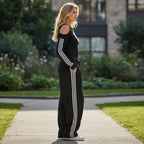 ZOFIA ATELIER black off-shoulder long sleeve polyester set with white stripes on sleeves and pants.