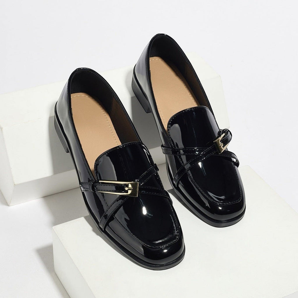 ZOFIA ATELIER black patent leather square toe loafers with gold buckle detail.