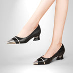 ZOFIA ATELIER black leather pointed toe pumps with silver cap toe and medium sculpted heel.