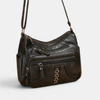 ZOFIA ATELIER black multi-layer PU crossbody bag with braided detail and studs