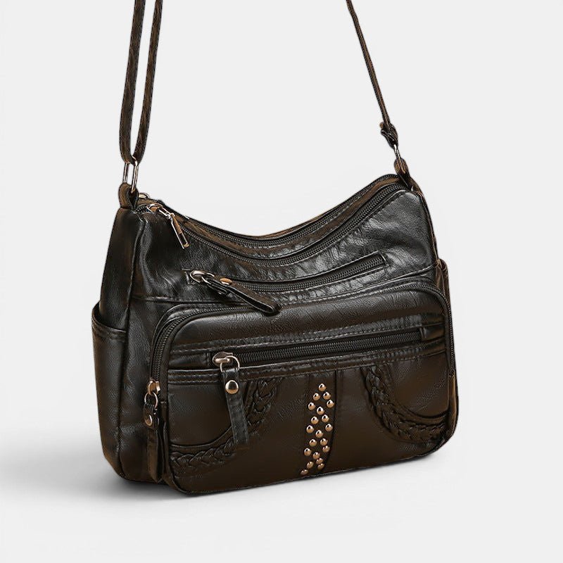 ZOFIA ATELIER black multi-layer PU crossbody bag with braided detail and studs