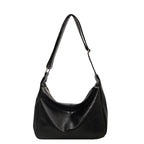 ZOFIA ATELIER black PU leather dumpling shape tote bag with single strap and polyester lining.