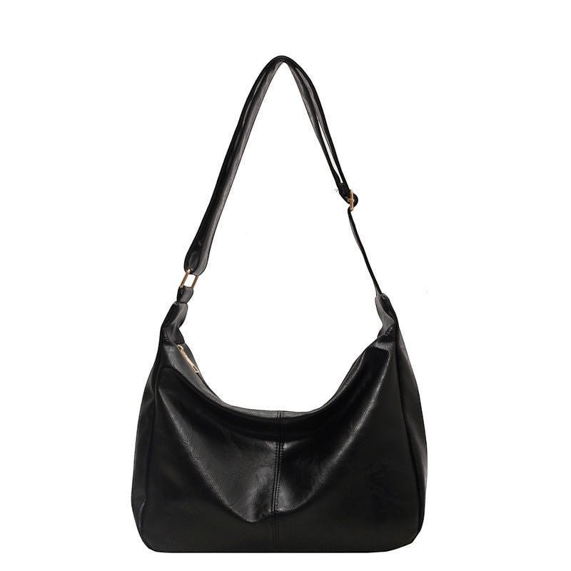 ZOFIA ATELIER black PU leather dumpling shape tote bag with single strap and polyester lining.