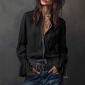 ZOFIA ATELIER black polyester long sleeve ruffled resort shirt with zipper detail and layered necklaces.