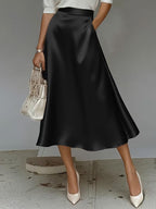 ZOFIA ATELIER black satin mid-length skirt with a slight stretch and flowy A-line silhouette.