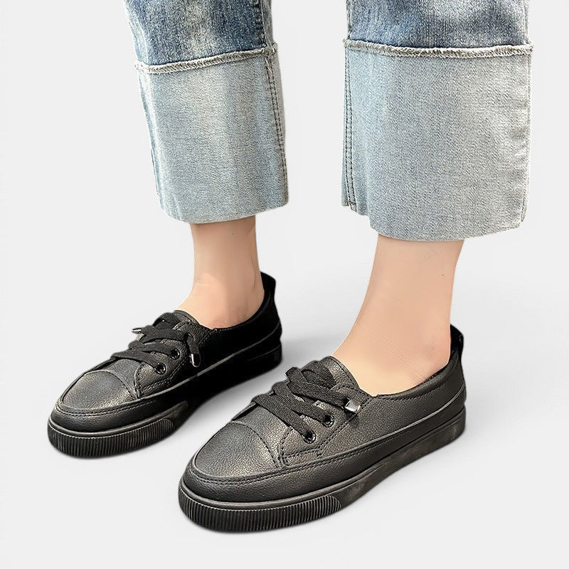 ZOFIA ATELIER black synthetic PU low-top sneakers with round toe and flat sole. Women's lace-up shoes.