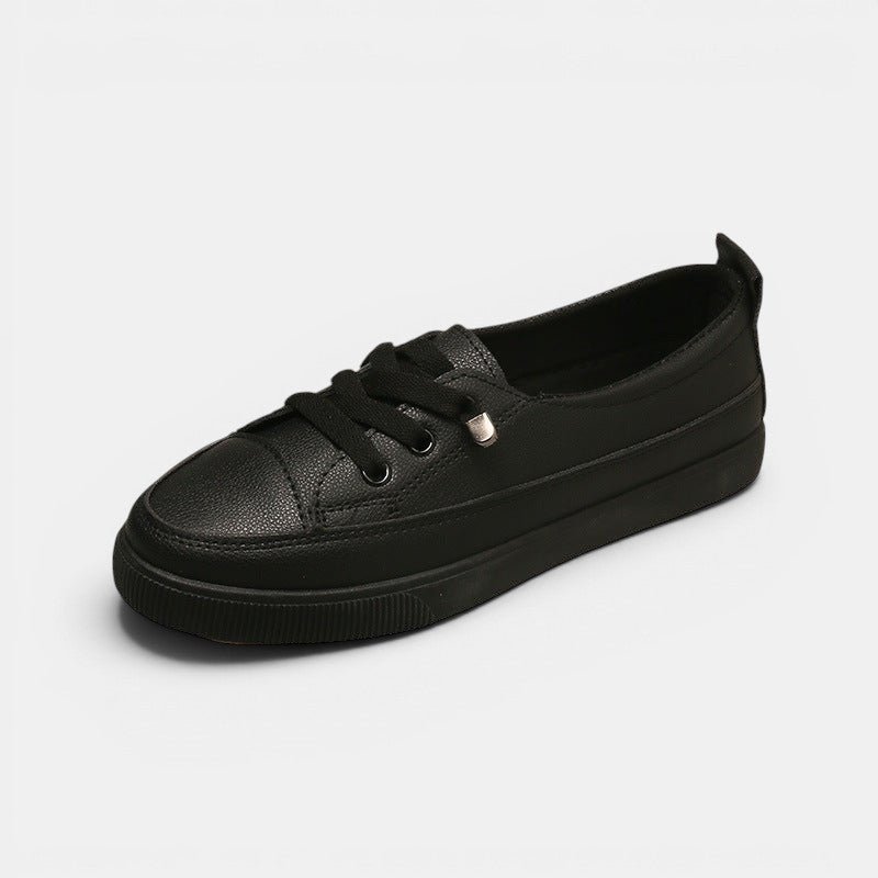 ZOFIA ATELIER black synthetic PU low-top sneakers with round toe and front laces. Flat heel.