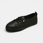 ZOFIA ATELIER black synthetic PU low-top sneakers with round toe and front laces. Flat heel.