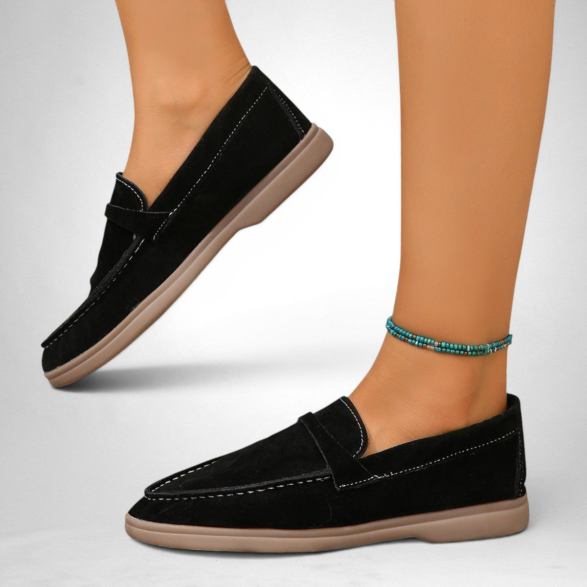 ZOFIA ATELIER black suede-style slip-on flats with contrast stitching and a flexible sole.