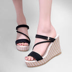 ZOFIA ATELIER black suede platform wedge sandals with criss-cross straps and woven espadrille detail.