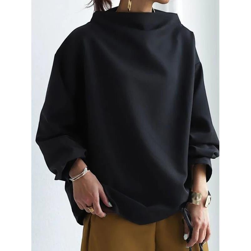 ZOFIA ATELIER BASIA loose black polyester sweater with mock neck and long sleeves, styled casually.