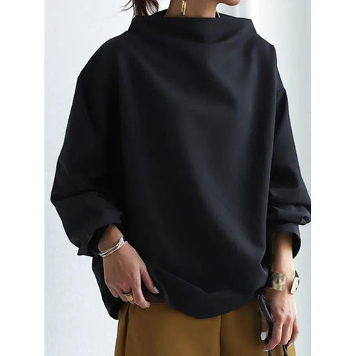 ZOFIA ATELIER BASIA loose black polyester sweater with mock neck and long sleeves, styled casually.