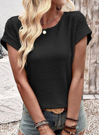ZOFIA ATELIER Isa black crew neck short sleeve waffle knit blouse with textured sleeves.