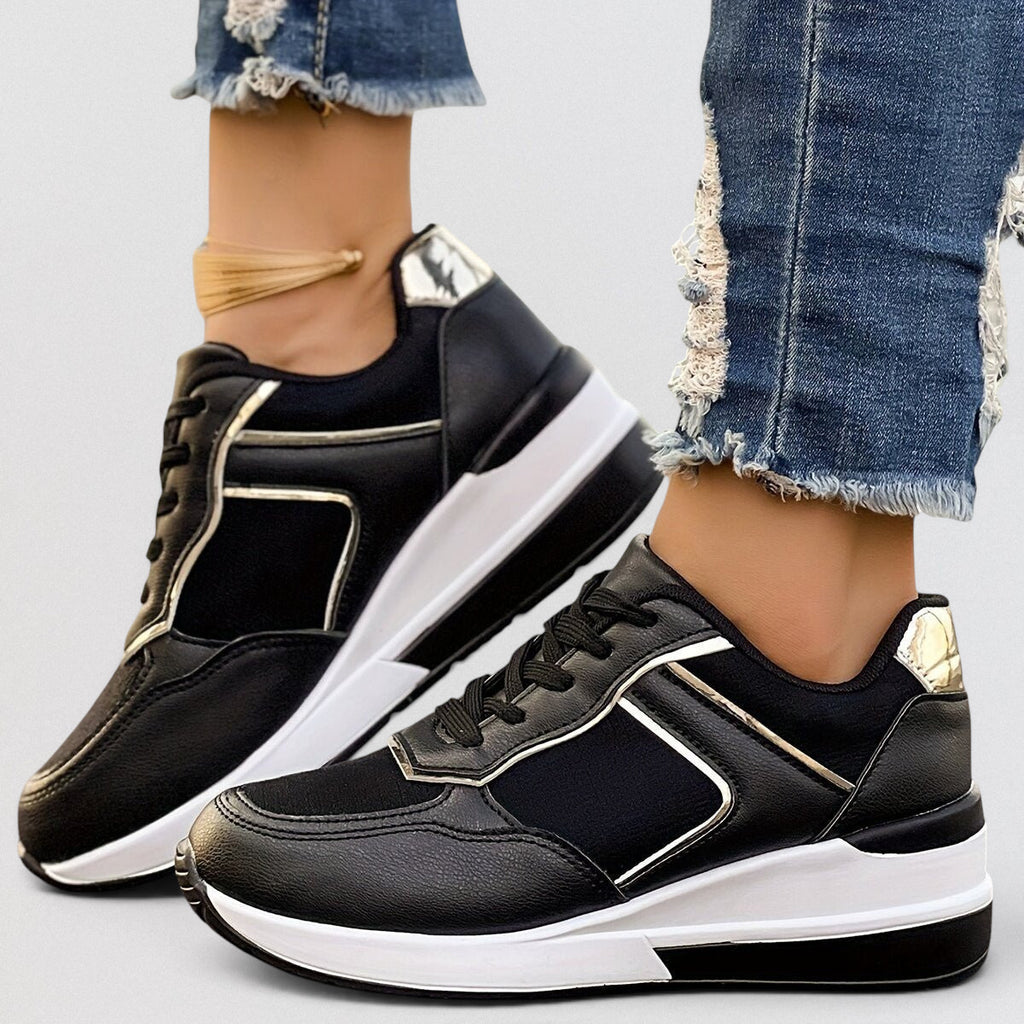 ZOFIA ATELIER black wedge leisure shoes with white soles and gold accents, round toe, lace-up front.