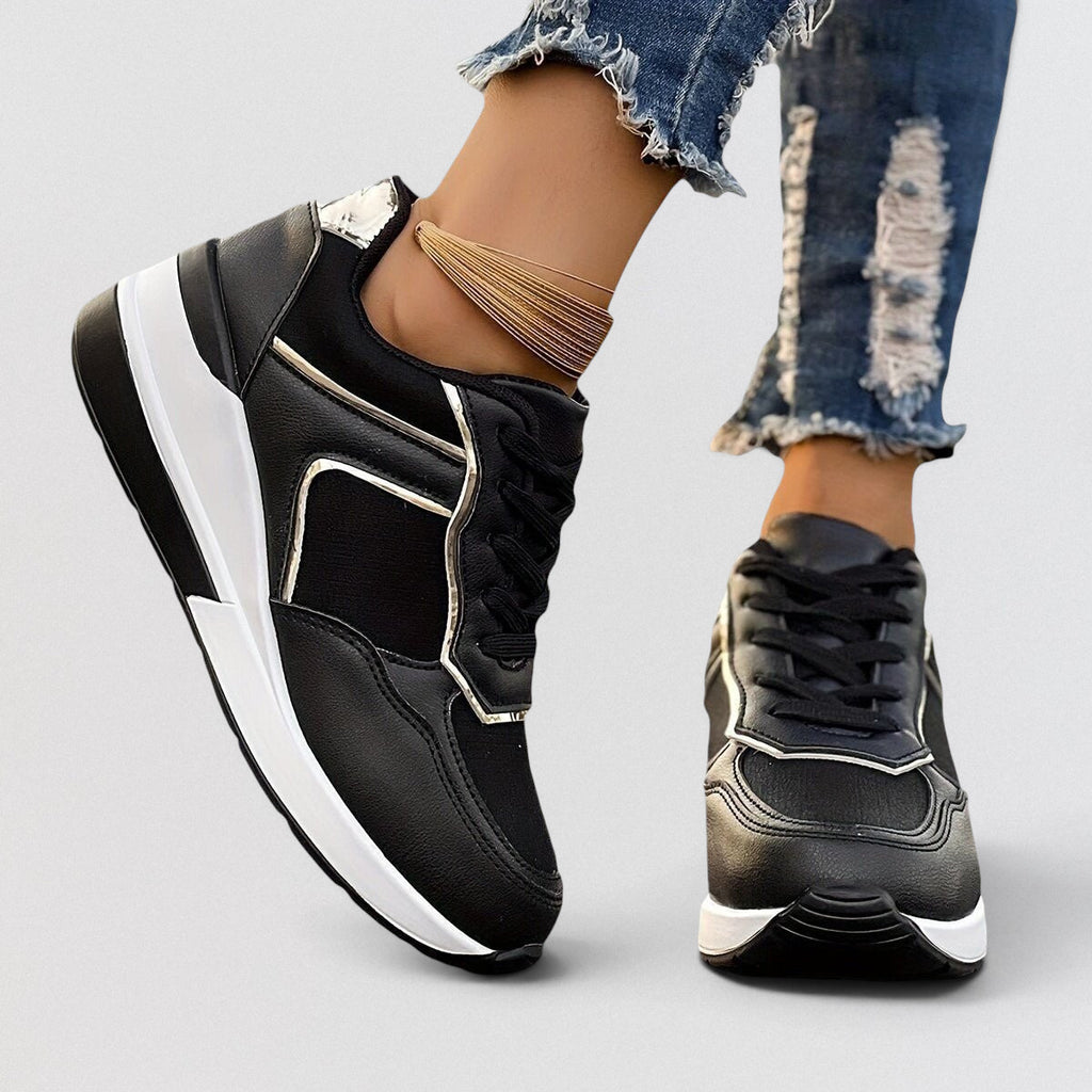 ZOFIA ATELIER black PU leather and microfiber wedge sneakers with white soles and lace-up front.