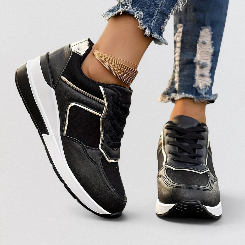 ZOFIA ATELIER black PU leather wedge sneakers with white soles and gold trim. Lace-up front.