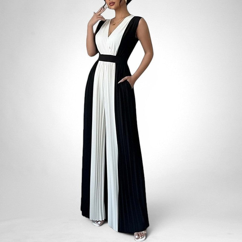 ZOFIA ATELIER black and white sleeveless V-neck wide-leg jumpsuit with pleated front panels and pockets.