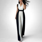 ZOFIA ATELIER sleeveless black and white pleated wide-leg jumpsuit with V-neckline and high waist.