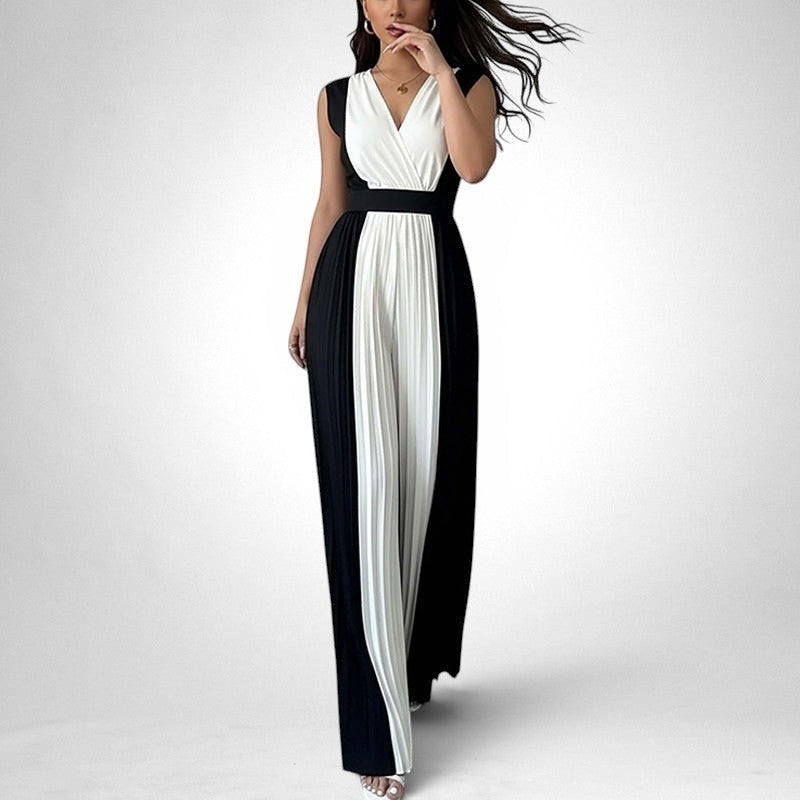 ZOFIA ATELIER sleeveless black and white pleated wide-leg jumpsuit with V-neckline and high waist.