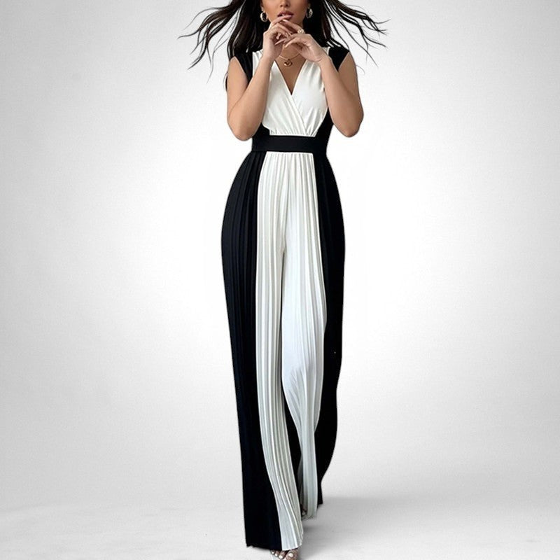 ZOFIA ATELIER black and white pleated wide-leg jumpsuit with V-neckline and sleeveless design.