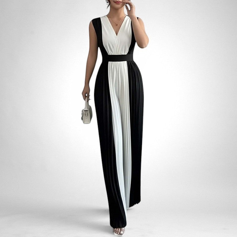 ZOFIA ATELIER sleeveless black and white pleated wide-leg jumpsuit with V-neckline and high waist.