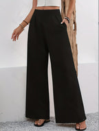 ZOFIA ATELIER black polyester wide-leg trousers with high waist and pockets.
