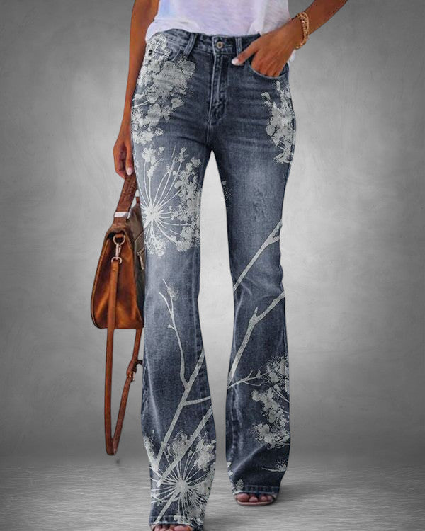 ZOFIA ATELIER blue denim flared jeans with white dandelion print, loose waist, and relaxed fit.