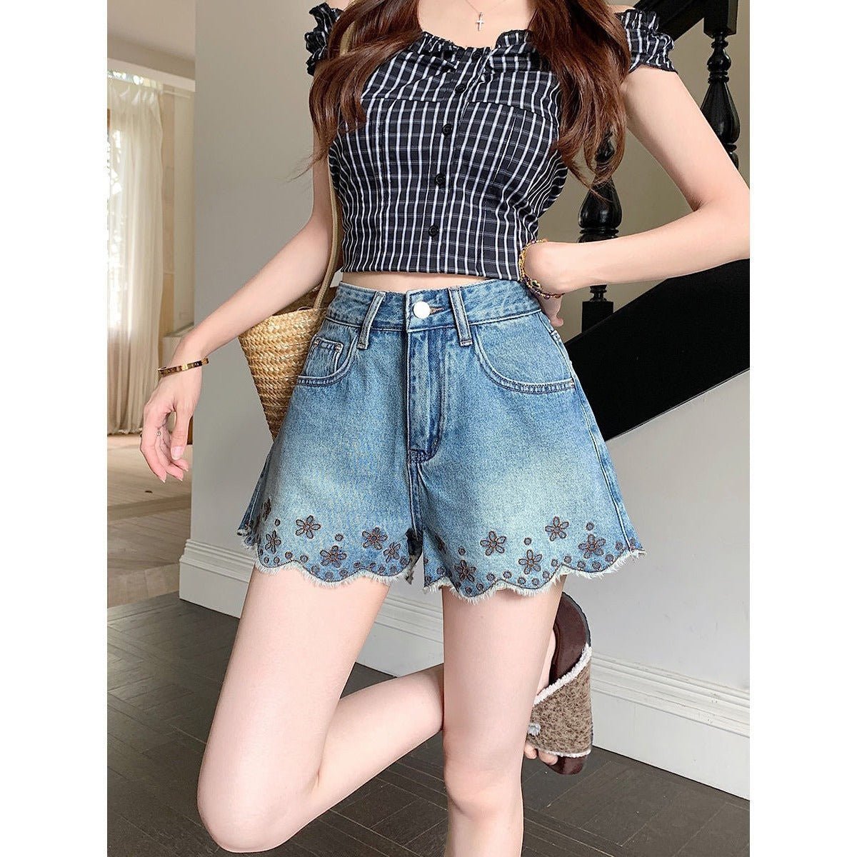 ZOFIA ATELIER blue denim shorts with embroidered floral trim and scalloped hem. Mid-rise waist.