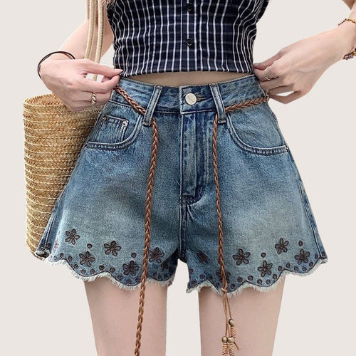 ZOFIA ATELIER blue denim shorts with embroidered flowers and frayed hem. Mid-rise waist, straight leg.