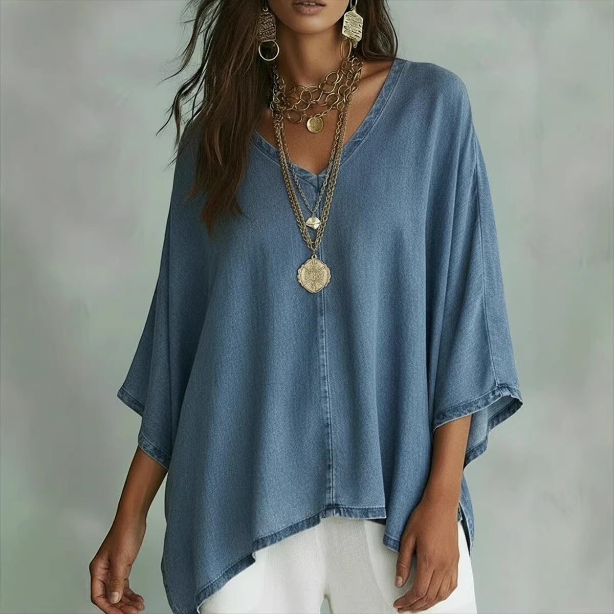 ZOFIA ATELIER blue washed-out denim tunic blouse with V-neck and batwing sleeves, relaxed fit.