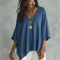ZOFIA ATELIER blue washed-out denim tunic blouse with V-neck and batwing sleeves, relaxed fit.