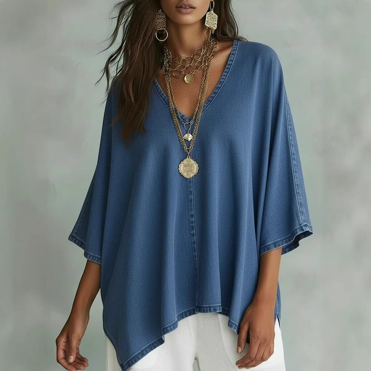ZOFIA ATELIER blue washed-out denim tunic blouse with V-neck and batwing sleeves, relaxed fit.
