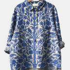 ZOFIA ATELIER blue and beige printed long-sleeve collared shirt with bird and floral motif.