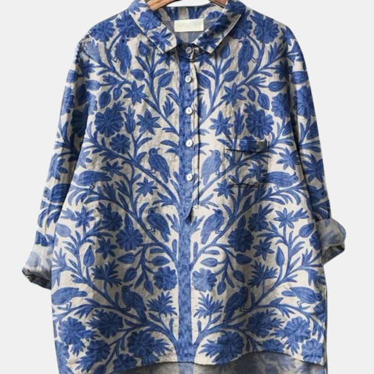 ZOFIA ATELIER blue and beige printed long-sleeve collared shirt with bird and floral motif.