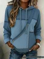 ZOFIA ATELIER blue denim effect polyester hooded top with long sleeves and a diagonal zipper detail.