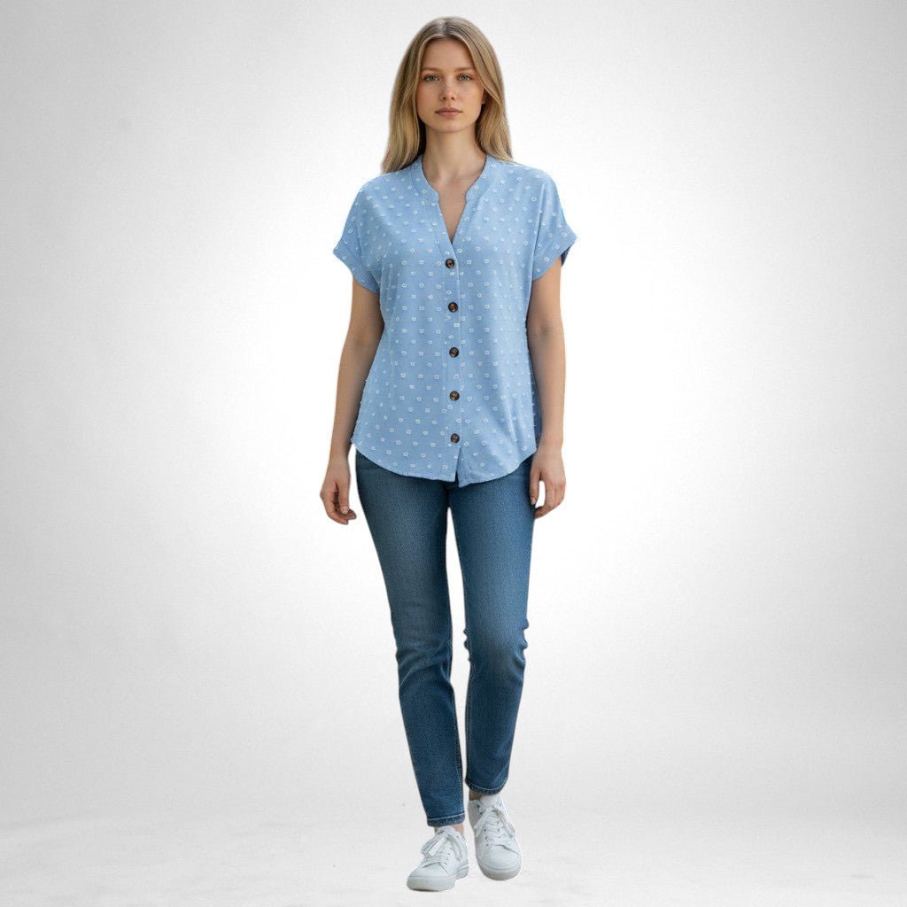 ZOFIA ATELIER light blue jacquard V-neck blouse with white dot pattern and button front, worn by a model with jeans.