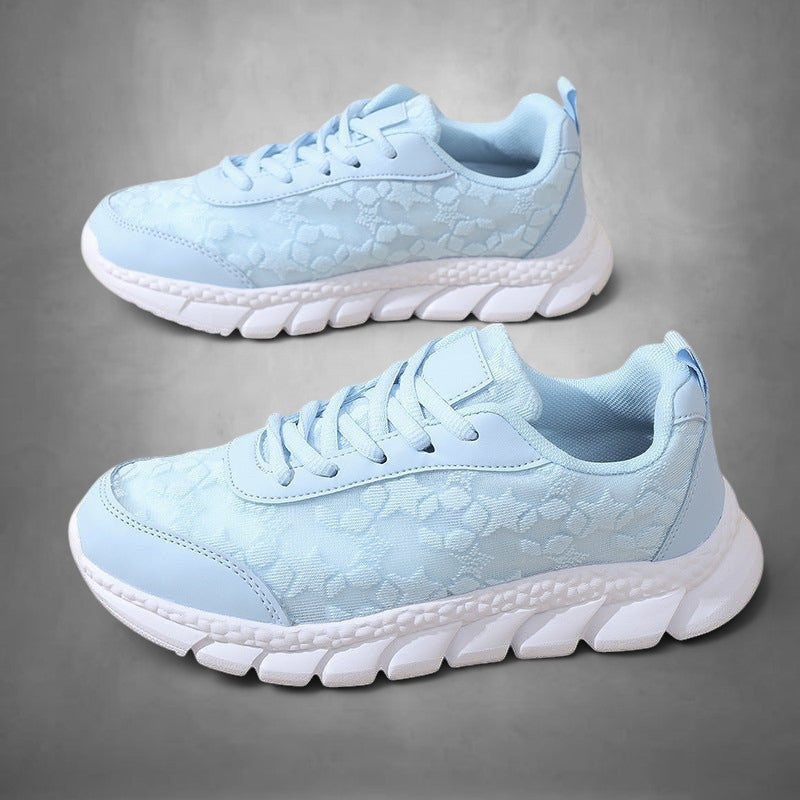 ZOFIA ATELIER light blue lace-up casual running sneakers with white rubber sole and breathable mesh upper.