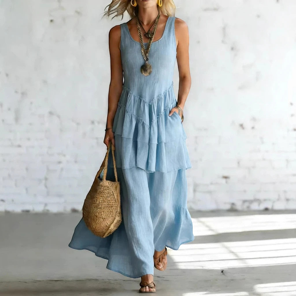 ZOFIA ATELIER light blue linen tiered sleeveless maxi dress with a relaxed fit and scoop neckline.