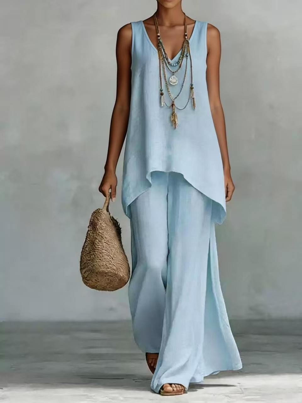 ZOFIA ATELIER light blue linen blend V-neck sleeveless vest and wide-leg pants set with layered necklace.
