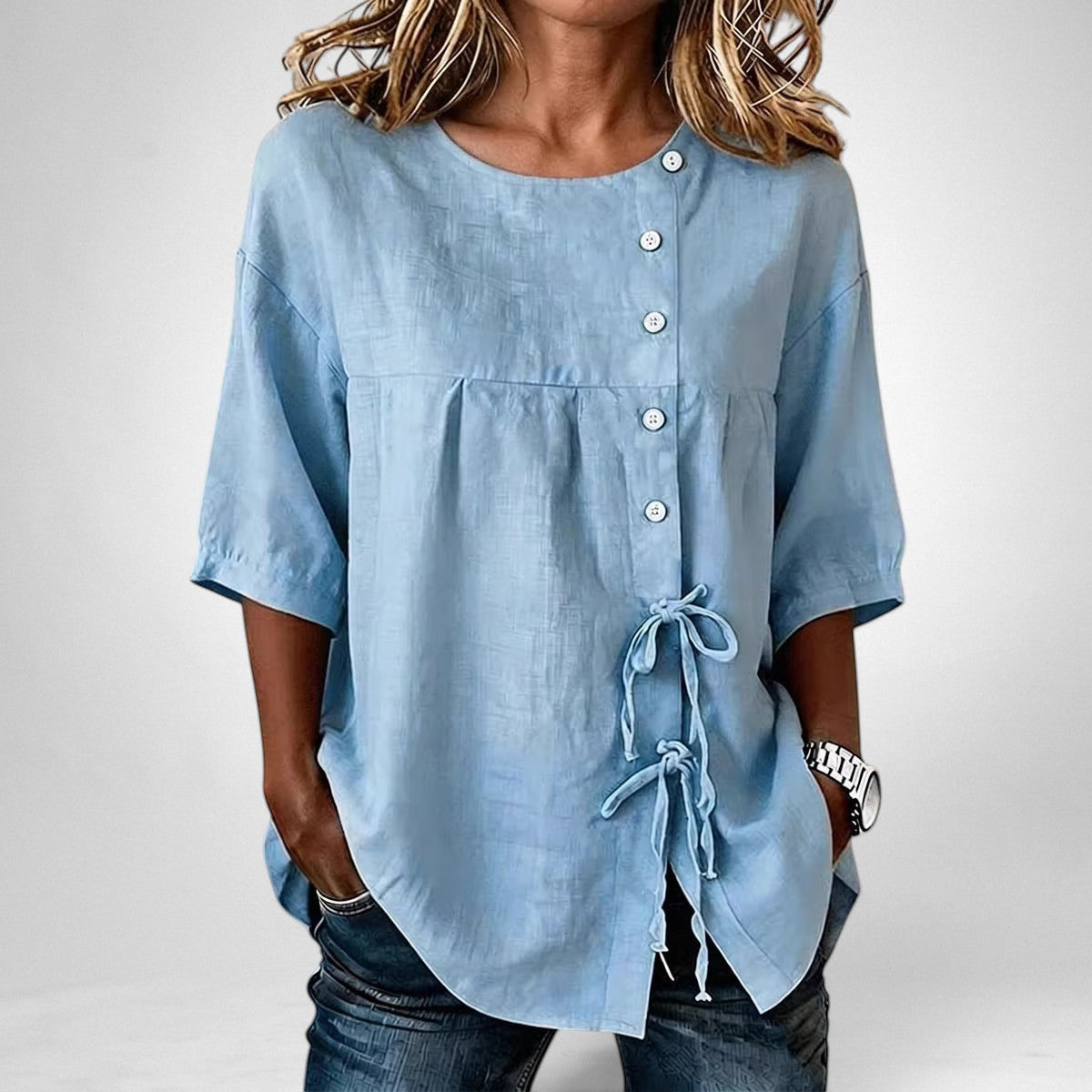 ZOFIA ATELIER light blue ice hemp asymmetric lace-up shirt with princess sleeves and button closure.