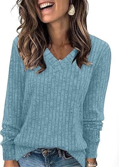 ZOFIA ATELIER light blue ribbed V-neck long sleeve t-shirt with a subtle vertical stripe pattern.