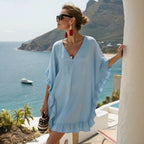ZOFIA ATELIER light blue ruffled V-neck beach dress with batwing sleeves, made of stretch polyester.